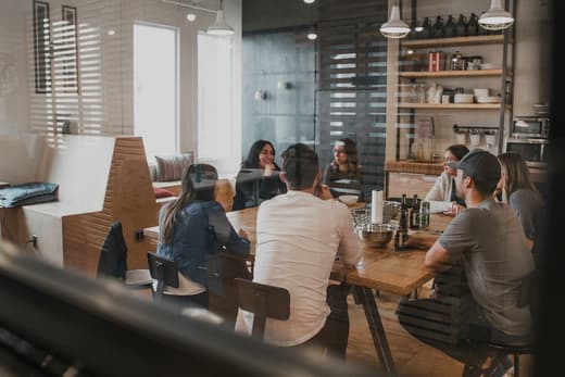 A professional services team working together around a table